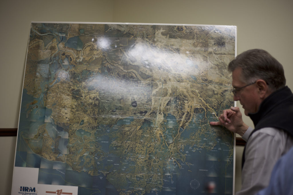 Mart Black uses a map of Terrebonne Parish to demonstrate the effects of relative sea level rise. Photo: Adam Kelnhofer 